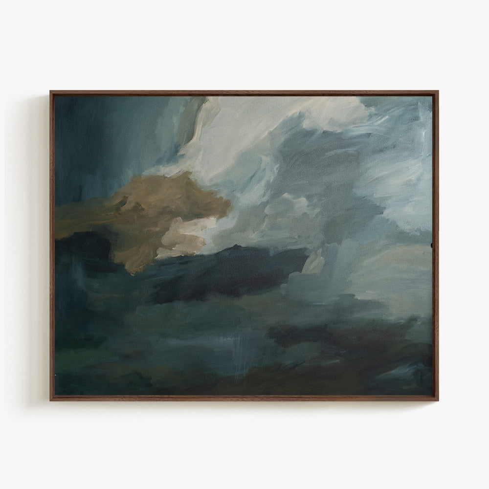 Abstract painting in a dark wood frame featuring turbulent brushstrokes in shades of dark blue white and brown