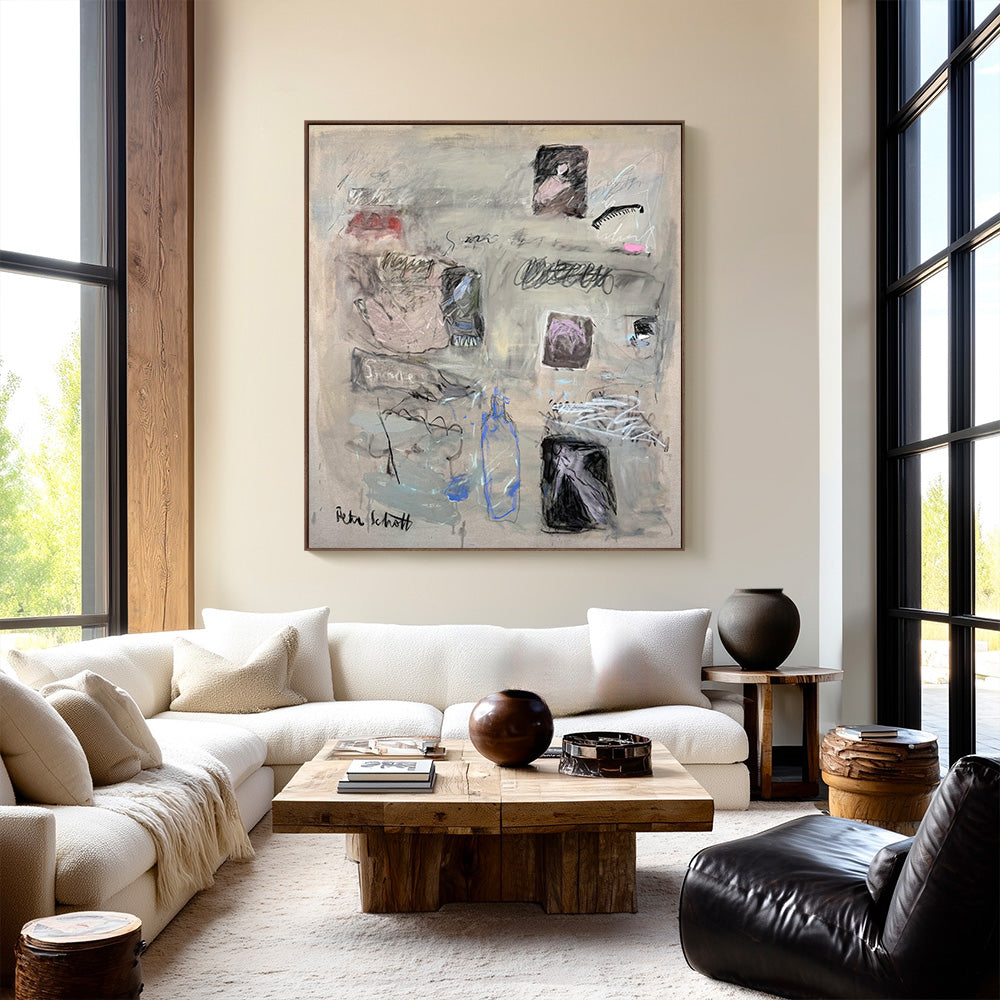 Large abstract square painting hung on a light-colored wall above a white sofa in a modern living room interior