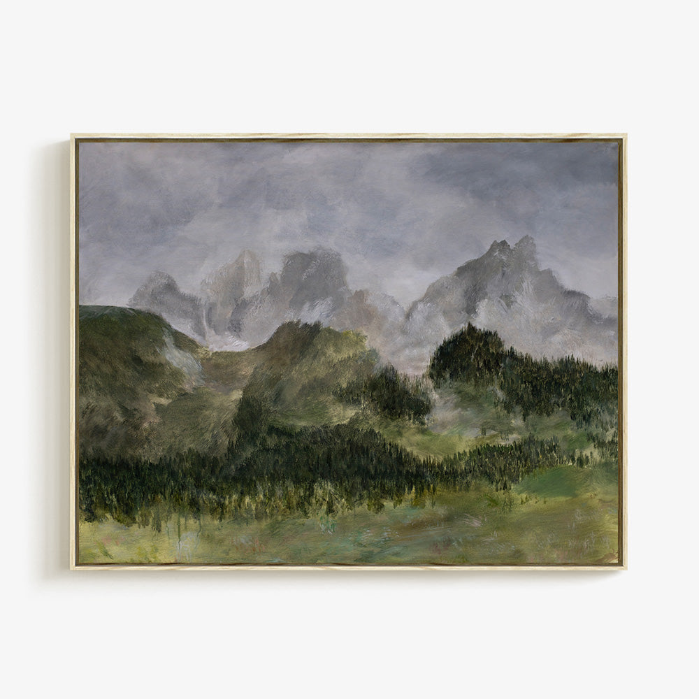 Painting of misty green mountains and dark green forest in a gold frame