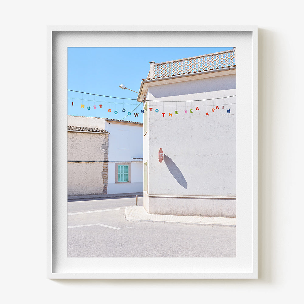 Down to the Sea print in a white frame featuring colorful letters spelling I MUST GO DOWN TO THE SEA AGAIN