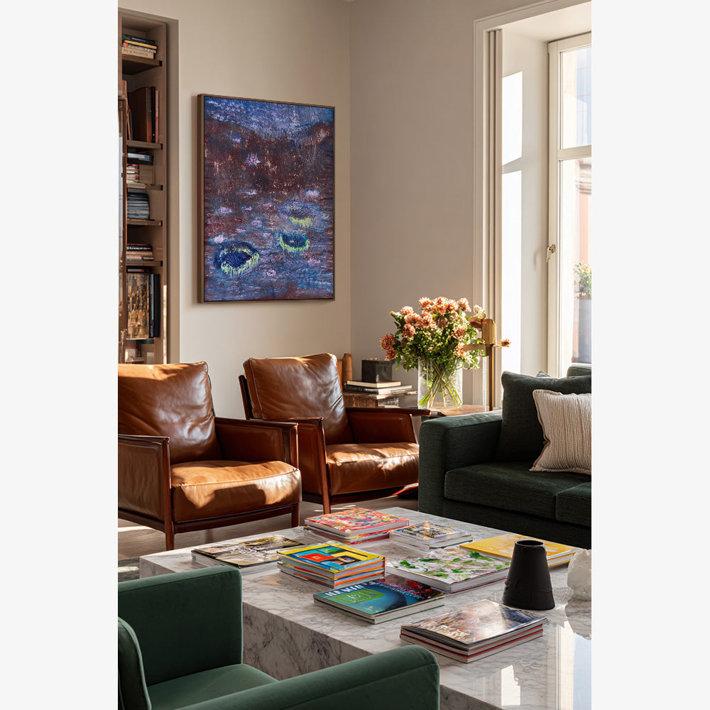 Abstract painting on wall with dark textured blue background and luminous rounded floating motifs in yellow
