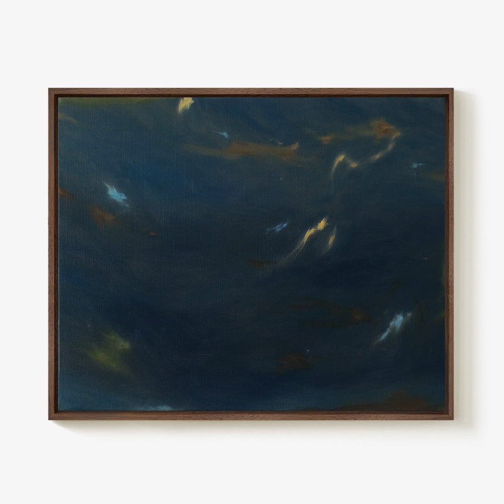 Framed horizontal painting in a dark wood frame featuring moody abstract strokes of blue and gold on a dark canvas