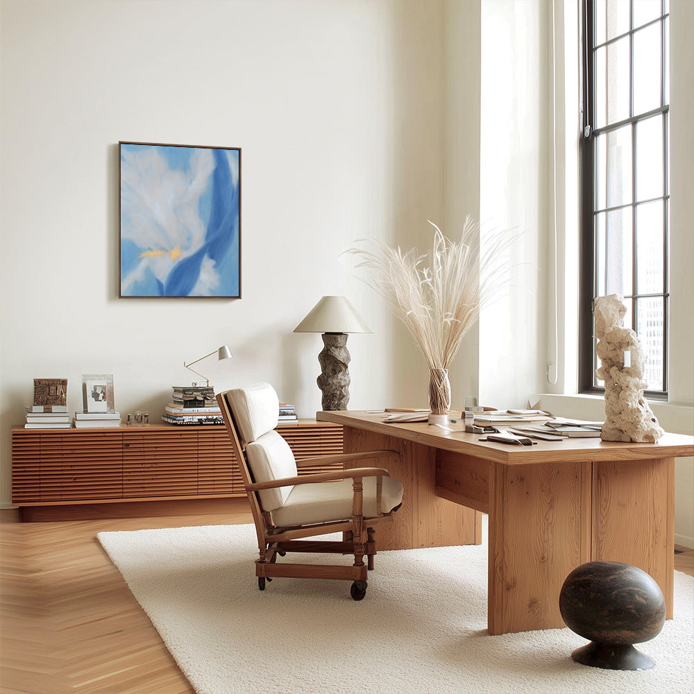 A modern home office with a blue abstract painting on the wall wooden desk office chair and decor accessories