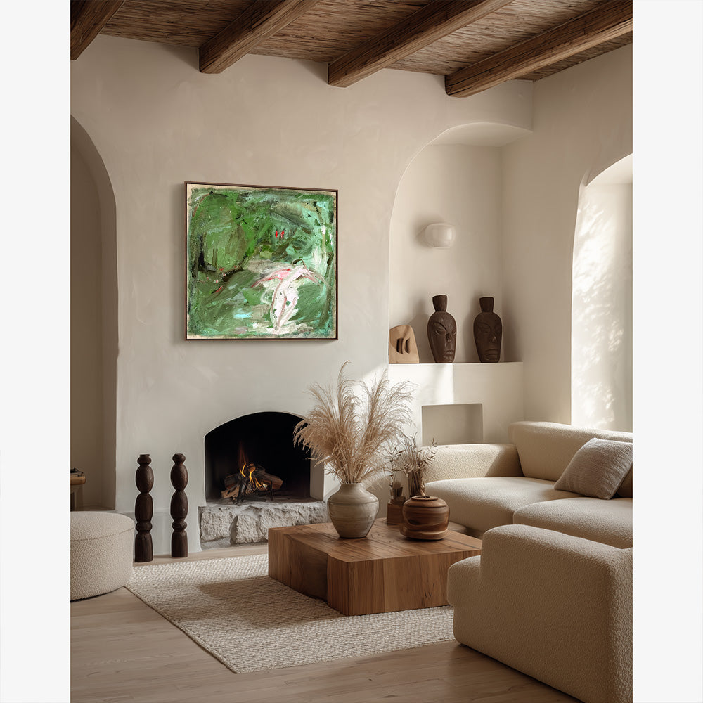 Abstract green painting hanging on a neutral wall above a fireplace in a room with warm wooden beams and furniture