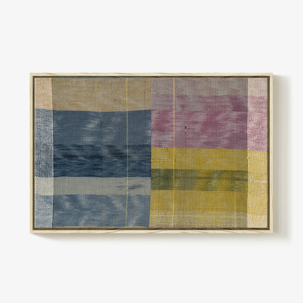 Textile art with a plaid pattern in blue yellow and purple mounted in a natural light wood frame