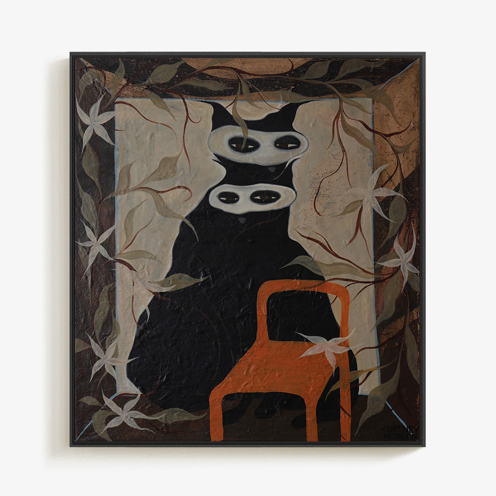 Painting of a stylized black cat with two white masks and an orange chair framed in a simple black border