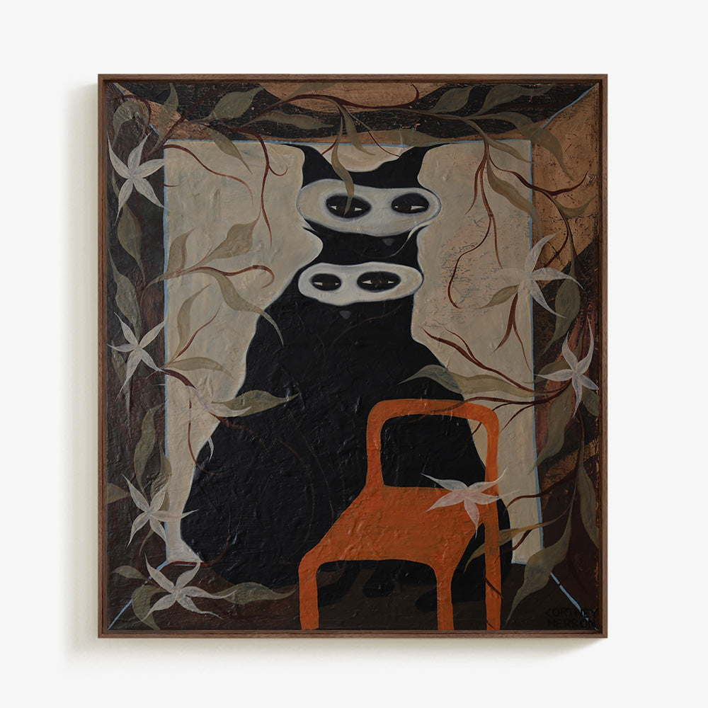 Framed painting of a surreal black cat character with two masks centered on a light-colored background