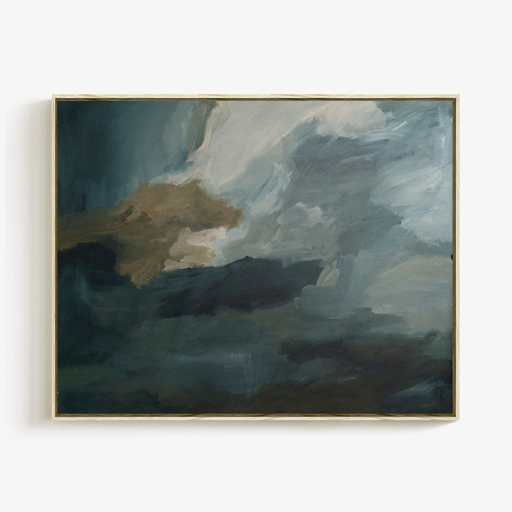 Abstract painting in a light wood frame featuring turbulent brushstrokes in shades of dark blue white and brown
