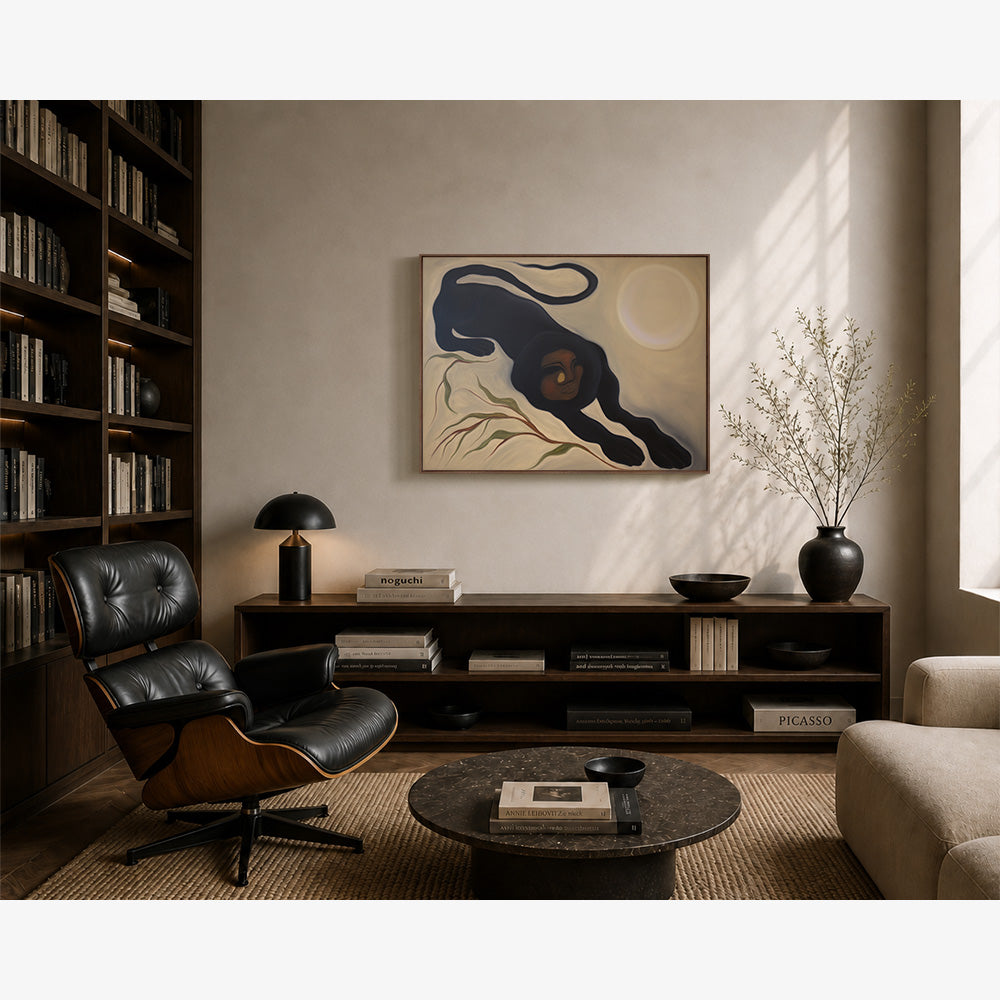 Living room featuring a framed painting of a black panther figure stretching against a pale moon background