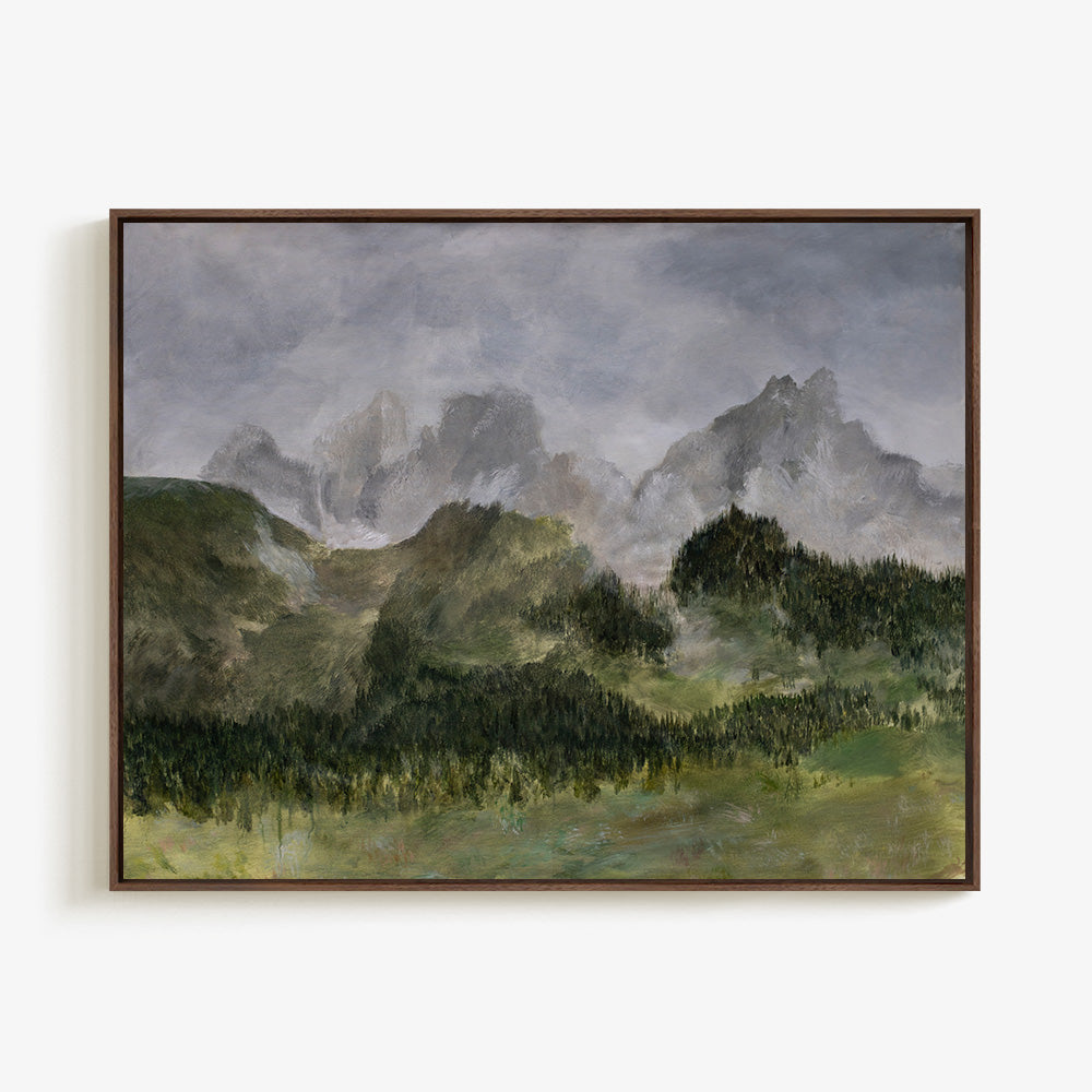 Painting of misty green mountains and dark green forest in a dark brown frame