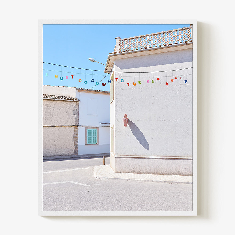 Down to the Sea print in a white frame featuring colorful letters spelling I MUST GO DOWN TO THE SEA AGAIN
