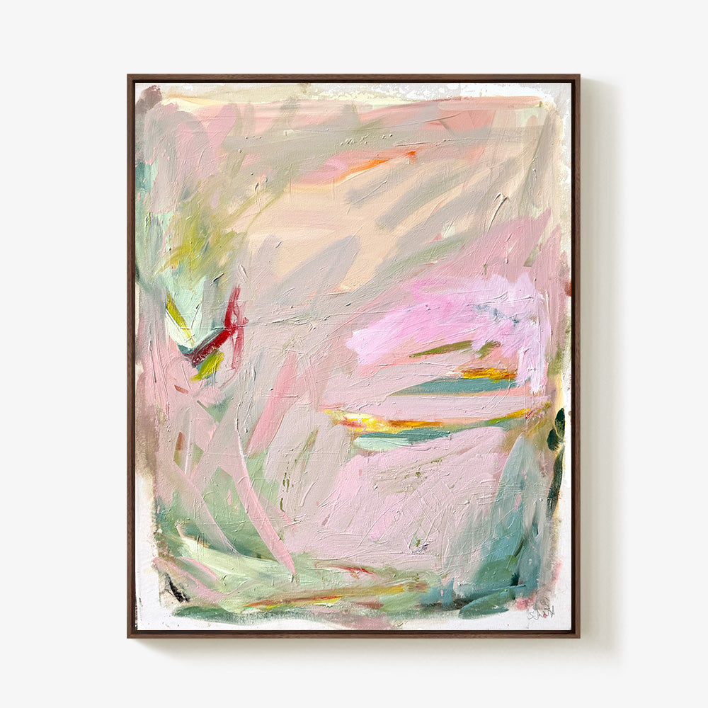 Abstract painting with a light wooden frame displaying soft layered strokes of pink teal and bright yellow