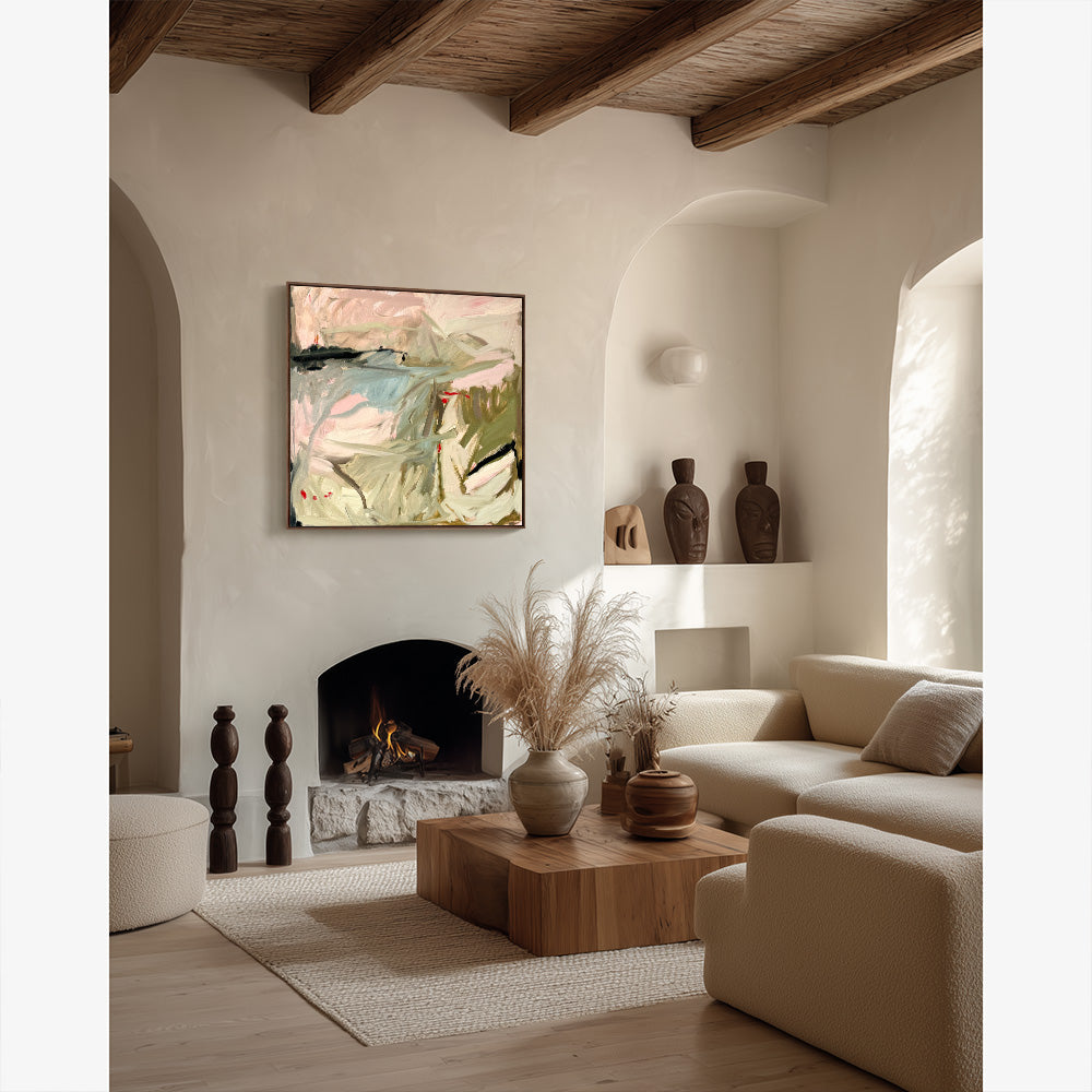 Living room with an abstract painting centered above a stone fireplace flanked by decorative wood carved sculptures