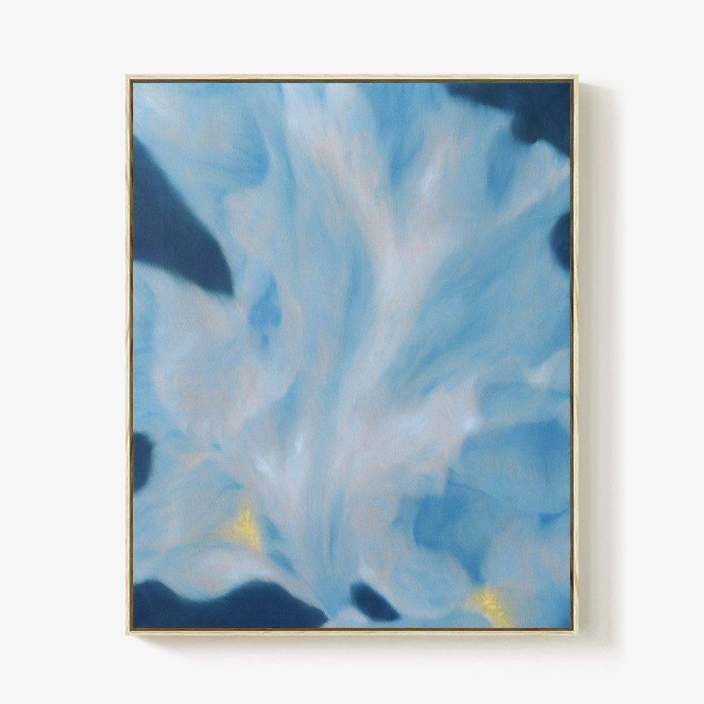 Abstract painting with sweeping strokes of light blue and deep navy in a thin gold frame
