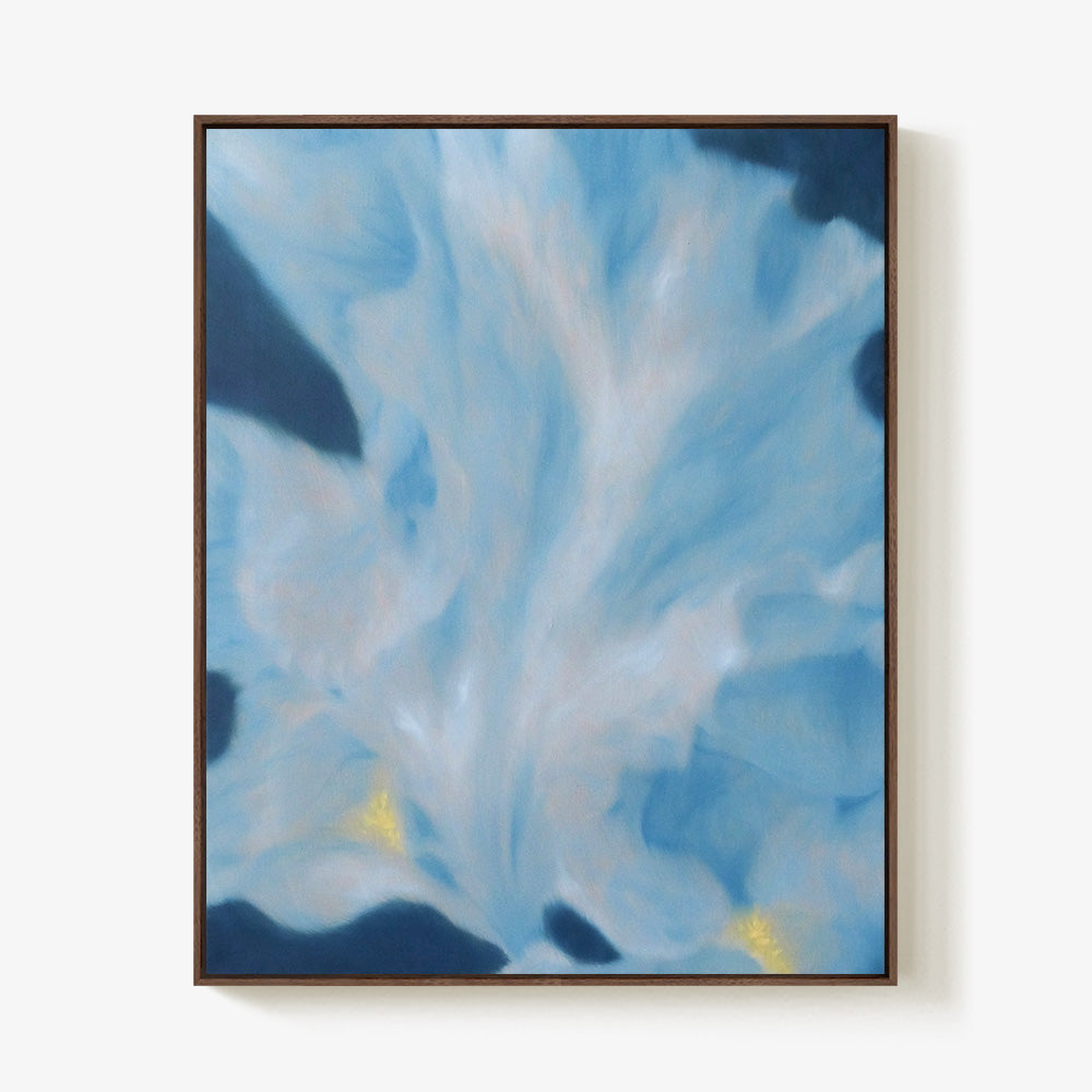 Abstract painting with fluid blue layers and subtle yellow highlights encased in a deep wood frame