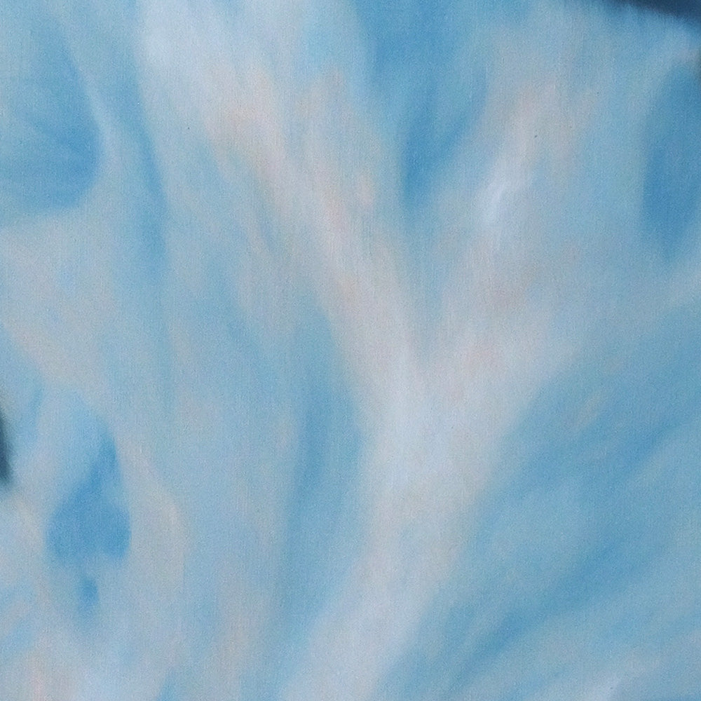 Detail view of abstract canvas with layered wash-like strokes of light and medium sky blue