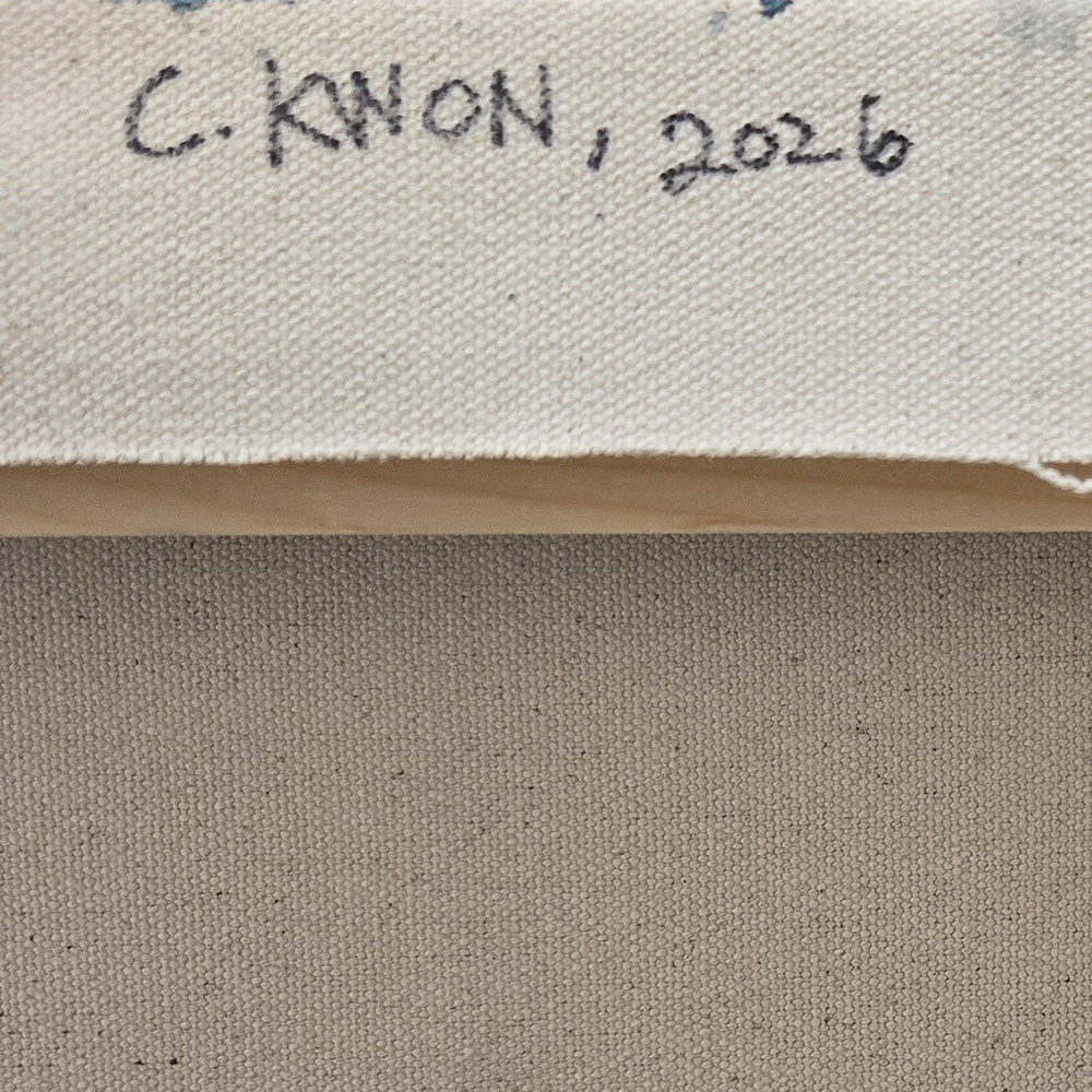 Back of a canvas showing the artist signature C KWON and the year 2026 written in black ink on white fabric