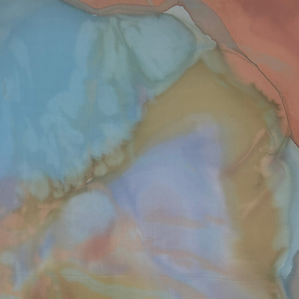Abstract painting with soft washes of light blue orange brown and hints of pink and purple blending seamlessly