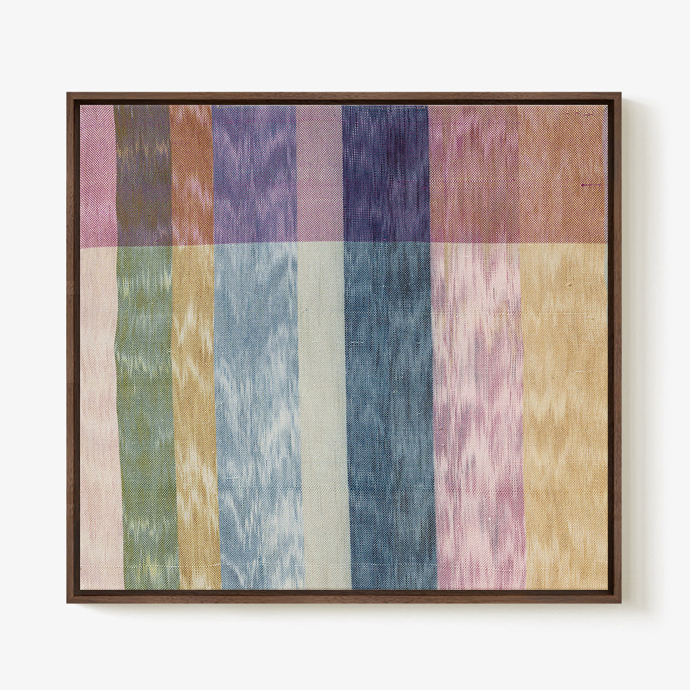 Textile wall art with vertical multicolored striped pattern framed in dark wood