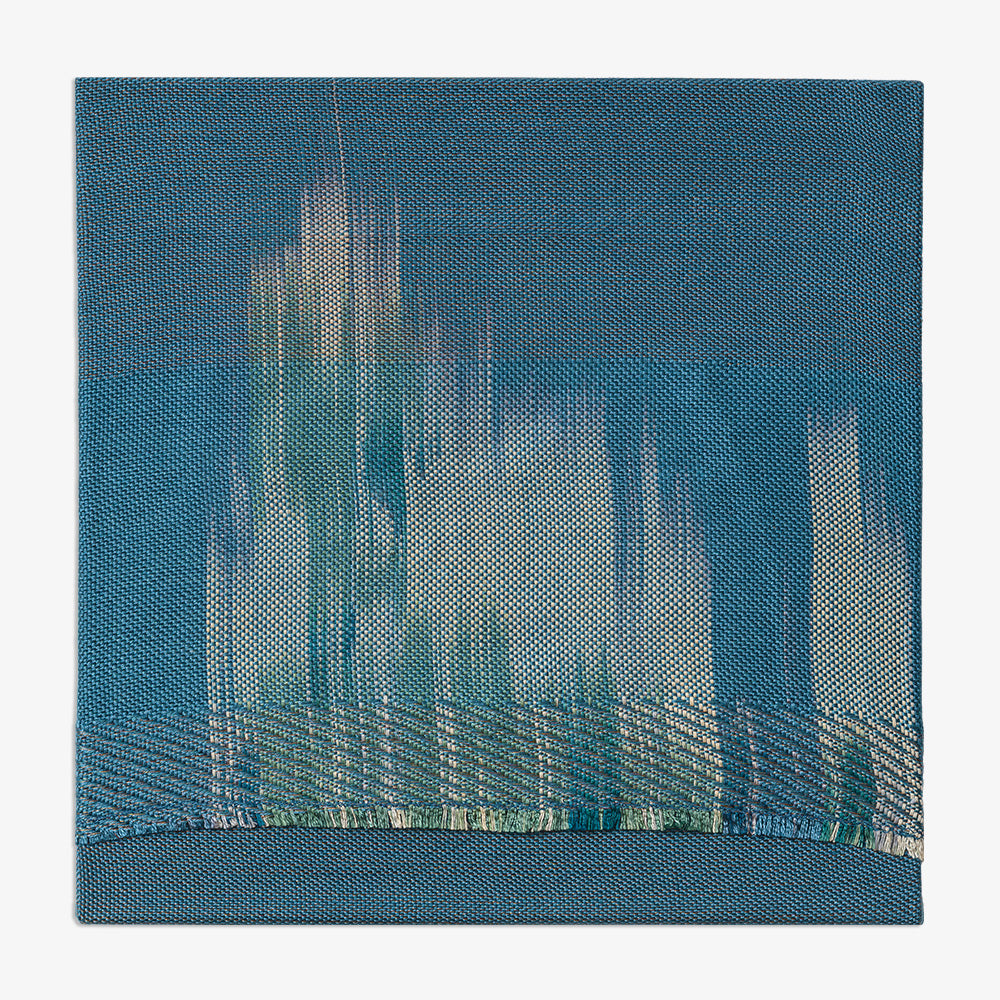 Blue textile artwork displaying abstract light-colored vertical lines structured with a textured bottom horizontal strip