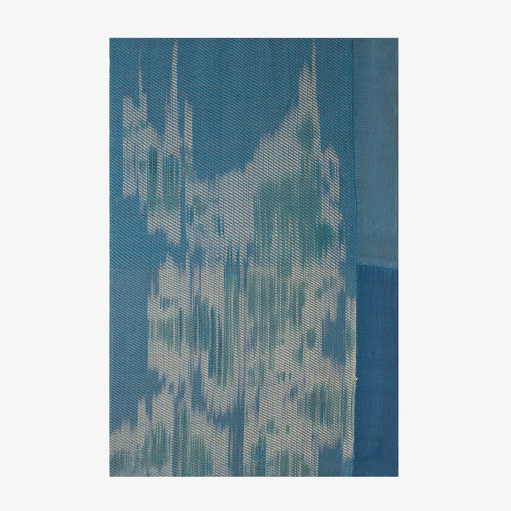 Vertical rectangular abstract textile with blended blue and white woven threads