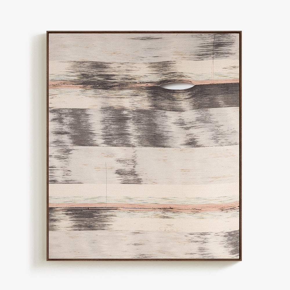 Rectangular woven textile with horizontal abstract gray and soft orange stripes framed in dark wood