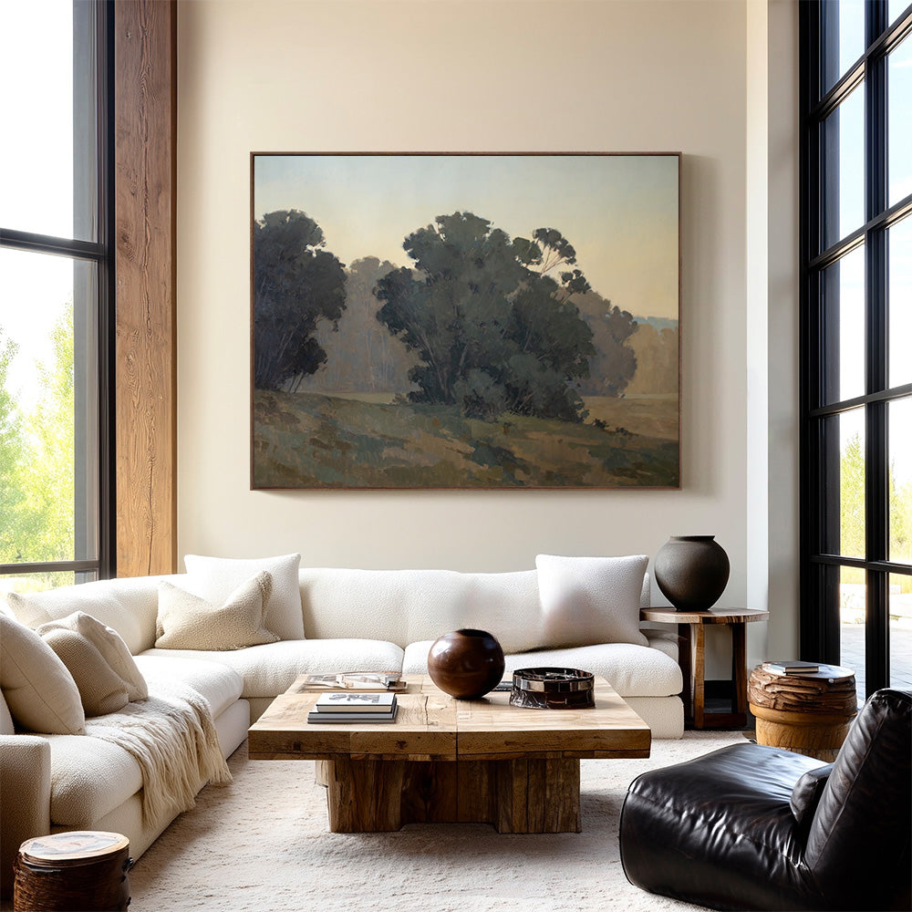 Original 60x74 landscape painting "What is Given" by Ashley Ozmint.  Trees in field with blue sky.  Painting in modern living room.